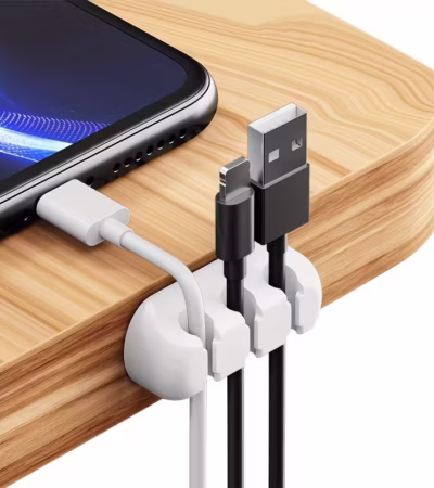 White 3 Slot Cable Organizer holding phone charger and USB cords on a nightstand