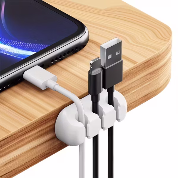 White 3 Slot Cable Organizer holding phone charger and USB cords on a nightstand