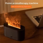 Flame Diffuser Humidifier emitting mist with a realistic LED fire effect on a bedside table