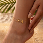 Woman wearing a Letter N Heart Anklet with double layer chain and heart charm