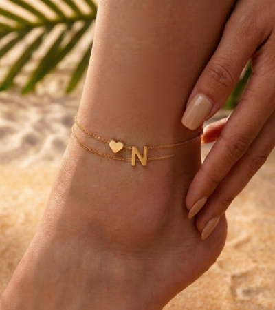Woman wearing a Letter N Heart Anklet with double layer chain and heart charm