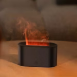 Flame Diffuser Humidifier emitting mist with a realistic LED fire effect on a bedside table