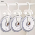 White Purse Hanger for Closet holding a leather handbag on a wardrobe rail