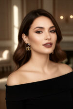 Front view of gold Dolce & Gabbana DG logo clip-on earrings