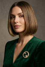 Asia wearing Gucci Blondie Crystal Brooch in gold-toned brass with interlocking logo design