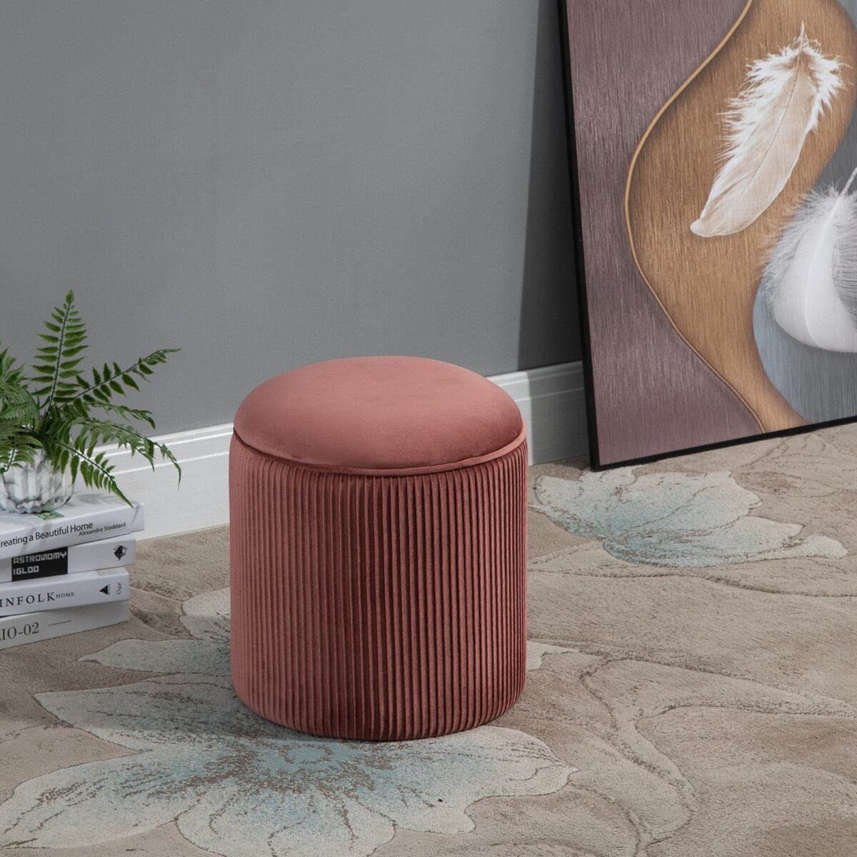 Round rose gold velvet ottoman with a unique pleated wrinkle design and plush padded top.