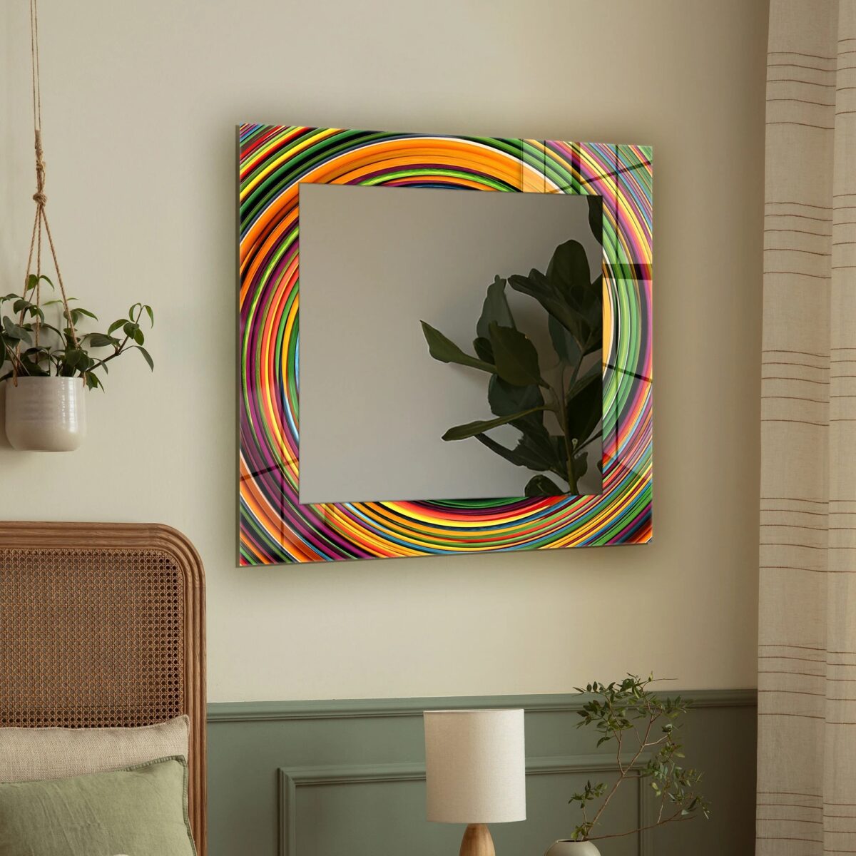 Square tempered glass wall mirror with a colourful abstract swirl-pattern frame on a marble wall