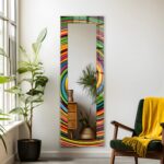 Horizontal tempered glass wall mirror with a colourful abstract swirl-pattern frame on a marble wall