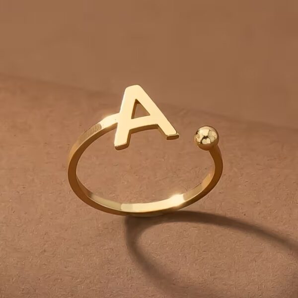Everly 10k Yellow Gold Initial A Open Ring with April Birthstone flush-set.