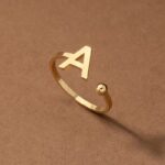 Everly 10k Yellow Gold Initial A Open Ring with April Birthstone flush-set.