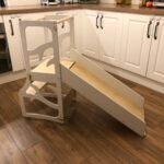 Convertible 3-in-1 kids learning tower shown in stool, desk, and slide positions made of natural birch plywood.