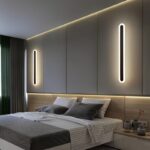 100cm long black minimalist LED wall light with 3000K warm white glow
