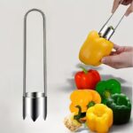 Red bell pepper with stainless steel seed remover tool inserted