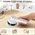 Handheld electric fabric shaver with six stainless steel blades and ergonomic grip for lint removal.