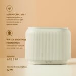 Black electric aroma diffuser with orange LED flame-effect mist.