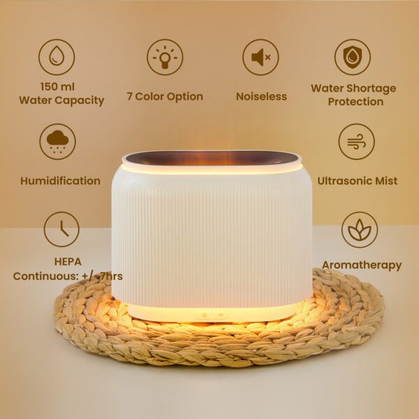 Black electric aroma diffuser with orange LED flame-effect mist.