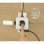 Smart energy monitor plug featuring E-ink screen showing monetary cost and touch power switch.