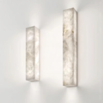 Lelantos waterproof LED wall light with an iron finish and copper accents is mounted on a modern wall.