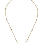 Close-up of Valentino Garavani Mini VLogo pendant with Swarovski crystals on a metal chain.