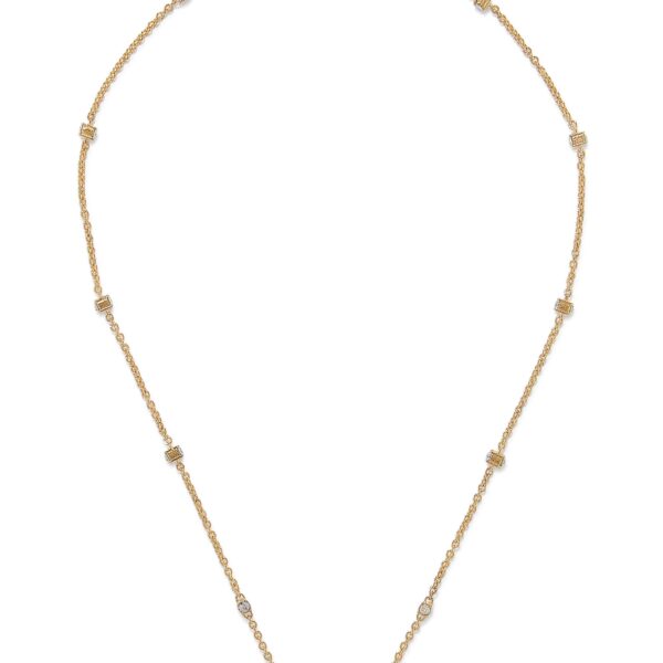 Close-up of Valentino Garavani Mini VLogo pendant with Swarovski crystals on a metal chain.