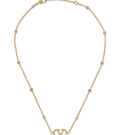 Close-up of Valentino Garavani Mini VLogo pendant with Swarovski crystals on a metal chain.