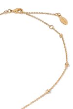 Close-up of Valentino Garavani Mini VLogo pendant with Swarovski crystals on a metal chain.