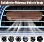 Round wooden car essential oil diffuser with magnetic lid and silicone-protected vent clip.