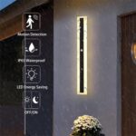 Long minimalist black LED wall light with acrylic enclosure on a modern exterior wall