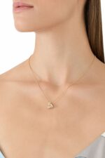 Close-up of Kate Spade Double Knot Pave Pendant with cubic zirconia stones