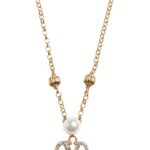 The Valentino Garavani VLogo Signature necklace featuring a pearl and Swarovski crystal pendant on a gold-tone chain.