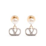 Valentino Garavani VLogo Signature earrings featuring pearls and Swarovski crystals on gold-tone metal.
