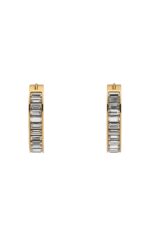 Close-up of Gucci Blondie light gold-toned hoop earrings with crystal embellishments.