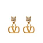 Pair of Valentino Garavani VLogo earrings in 18kt gold-plated brass with Swarovski crystal studs.