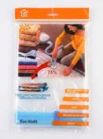 A transparent 60x80cm vacuum storage bag containing a folded blue quilt being compressed by a vacuum cleaner nozzle.