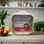 Stack of 50 square brown parchment paper liners for air fryers 20cm