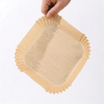 Stack of 50 square brown parchment paper liners for air fryers 20cm