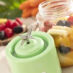 Green InnovaGoods Blendyr portable cup blender with 6 steel blades and USB charging