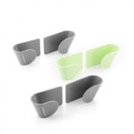 Set of three green and grey adhesive holders for saucepan lids