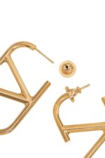 Designer gold VLogo earrings by Valentino Garavani. Luxury statement jewelry for women’s fashion and gifting.