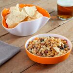Two-piece stackable InnovaGoods snack bowl set in white and orange