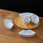 Set of 6 assorted elegant serving plates arranged with snacks and appetizers