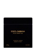 A luxury black glass candle featuring the Dolce & Gabbana Velvet Desert Oud label, presented in a velvet box.