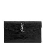 Front view of YSL Uptown Pouch in black crocodile-embossed leather with silver YSL initials