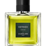 The elegant glass bottle of Guerlain Vétiver Parfum showing the rich golden fragrance liquid.