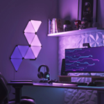 Nanoleaf Shapes Mini Triangles 9-pack starter kit mounted on a wall.