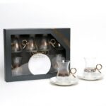 Set of 6 elegant tea cups and 6 saucers on a table