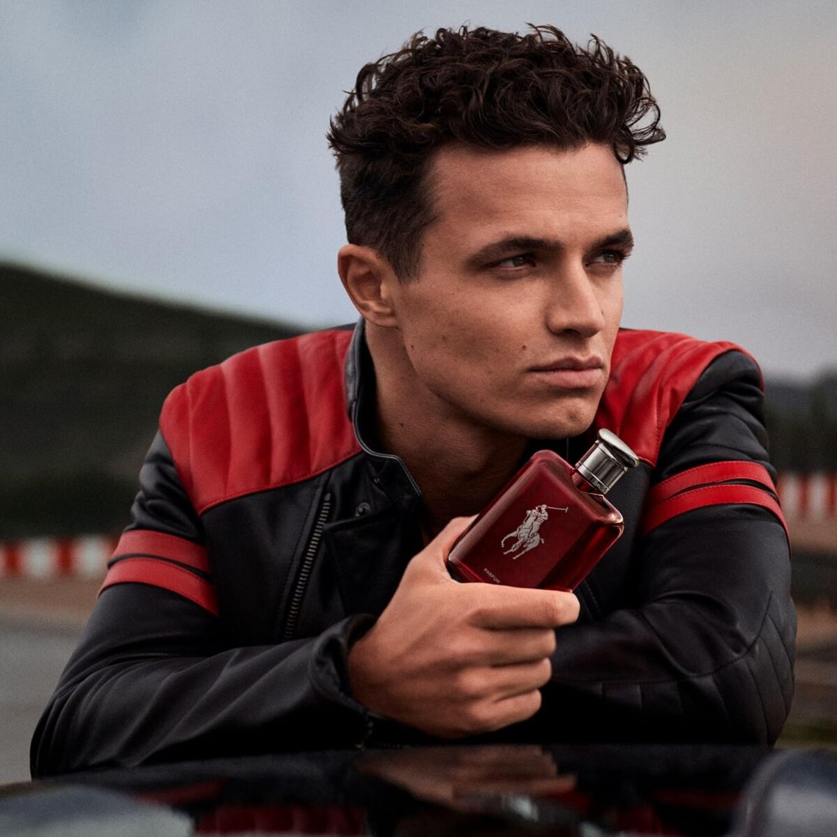 75ml sleek red bottle of Ralph Lauren Polo Red EDP for men with a woody scent profile.