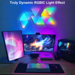 Three Nanoleaf triangular light panels glowing in different colors