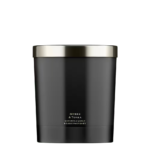 A minimalist black glass Jo Malone London Myrrh & Tonka Home Candle on a neutral background.