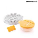 Orange and grey microwave chip maker tray with sliced potatoes and mandolin